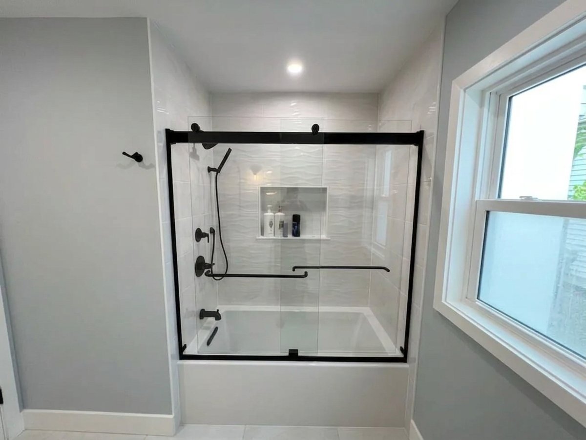 Bathroom renovation in Nassau County NY with white subway tile tub and shower combo - Best In Class Renovations